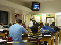 Student gives verbal presentation with Powerpoint